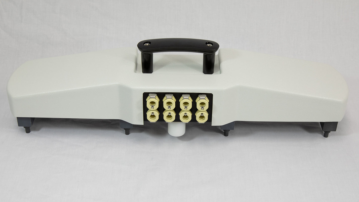 A white plastic device with eight colored ports connected to it, positioned on a neutral background.
