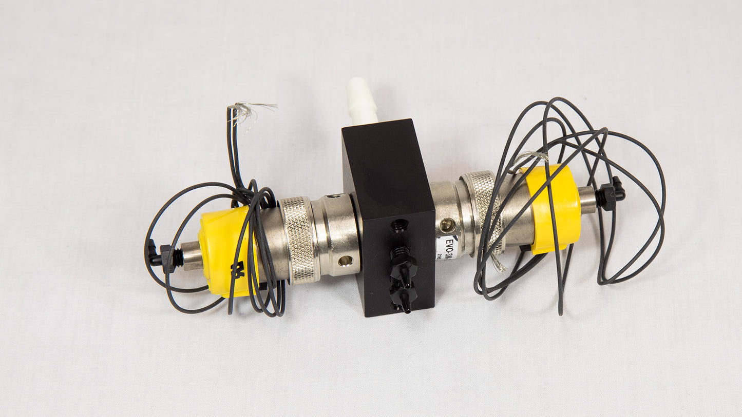 A yellow and black device featuring several attached wires, suggesting its use in a technical or electrical context.