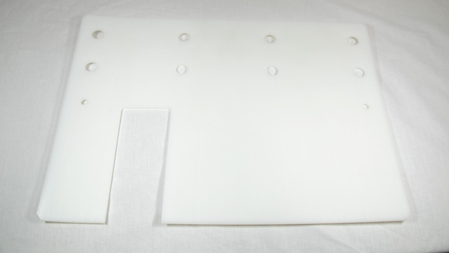 A white plastic plate featuring multiple holes evenly distributed across its surface.