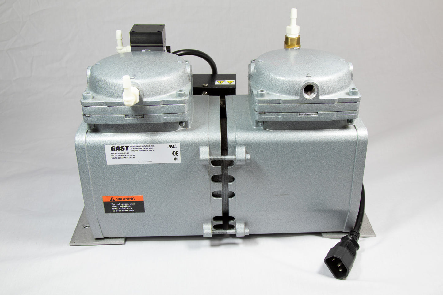 A small pump featuring two valves, designed for efficient control.