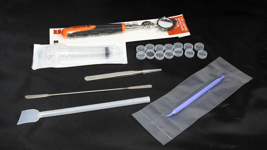 An assortment of parts displayed on a black background.