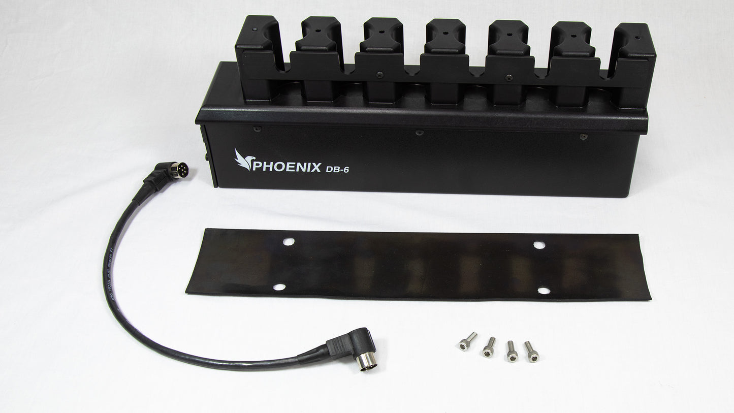 A black box with four wires extending from it, along with a power cord for connectivity.