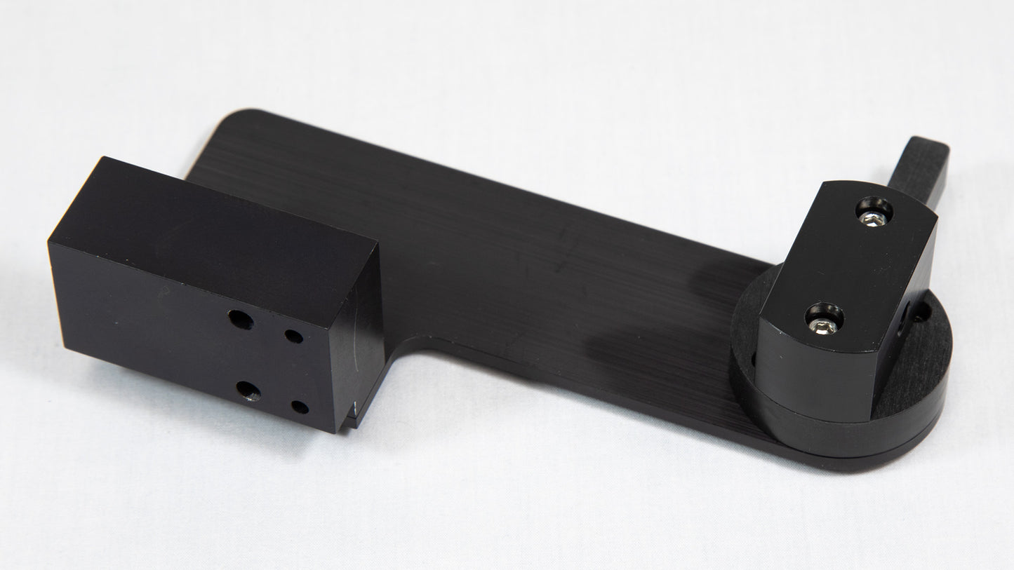 A black object, likely designed for a specific use or to connect with other components.