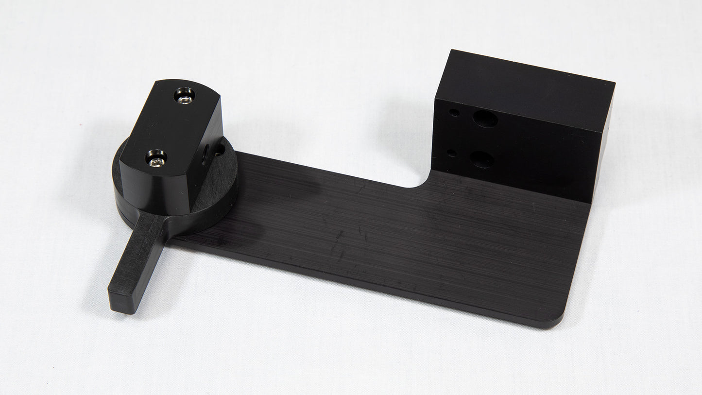 A black object, likely designed for a specific use or to connect with other components.