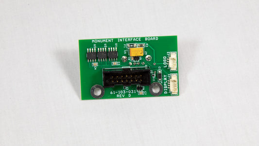 A green electronic circuit board with various components displayed on top.