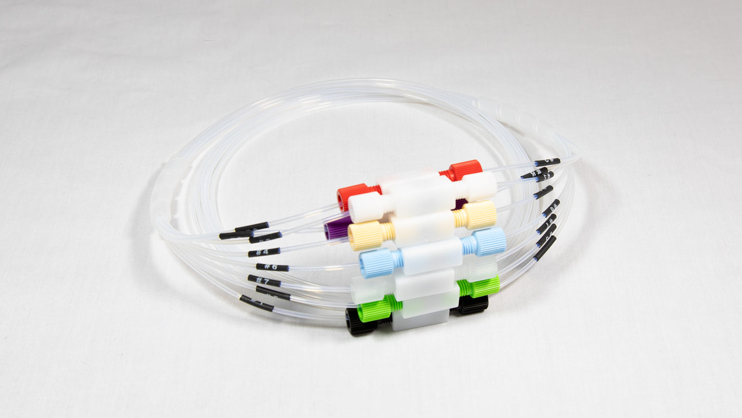 A collection of plastic tubes, each with a unique colored connector, displayed together for visual contrast.