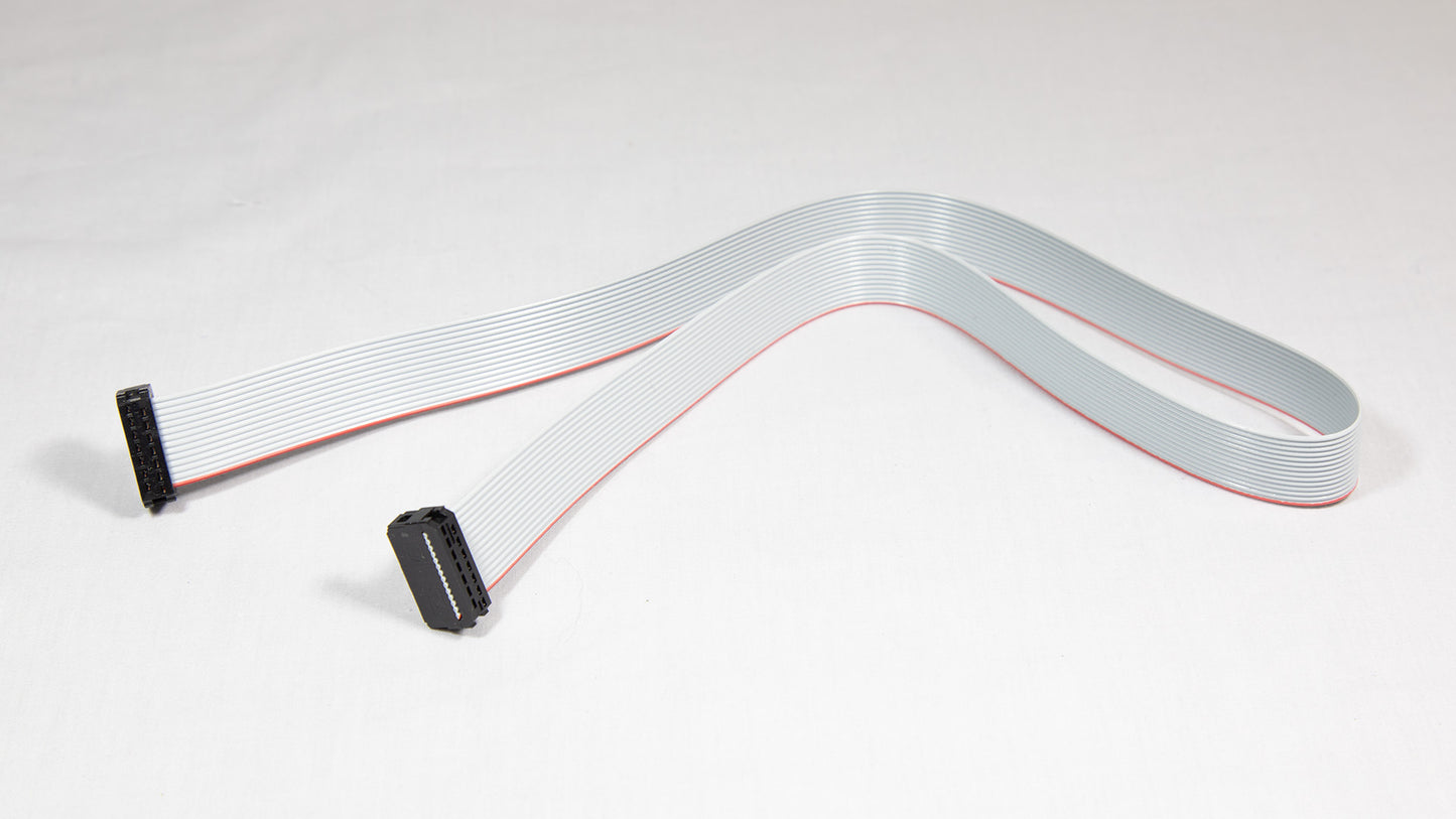 A white cable adorned with red and black stripes, showcasing a distinct pattern.