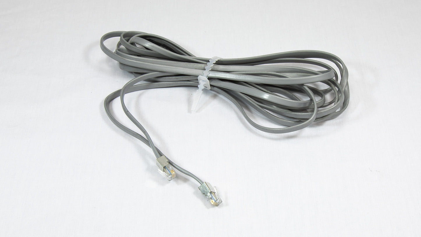 A grey cable with connectors, representing a typical element found in various communication connections.