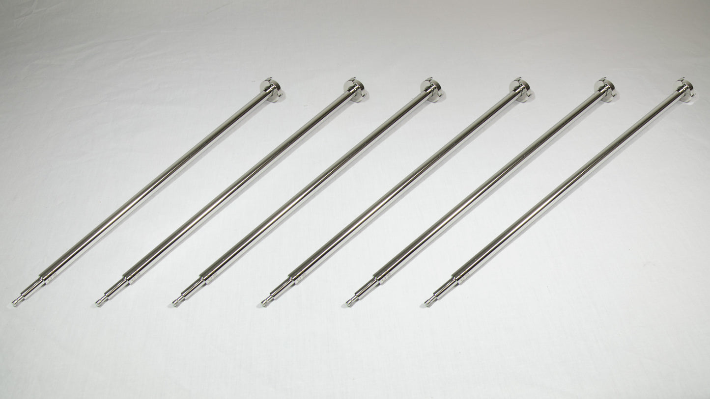Six uniquely shaped metal rods positioned together for comparison.