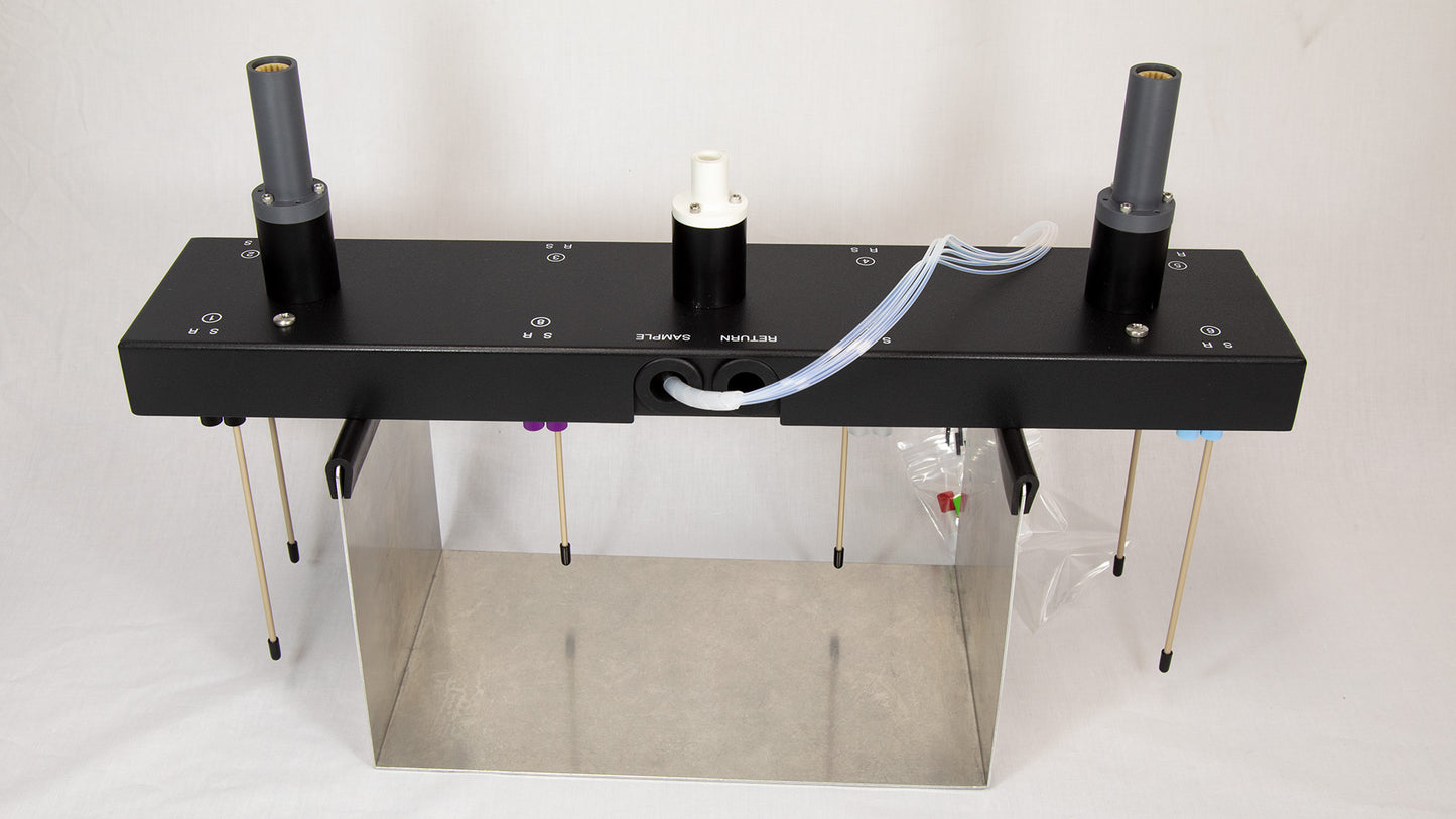 An apparatus with tubing attached, indicating its operational setup and design.