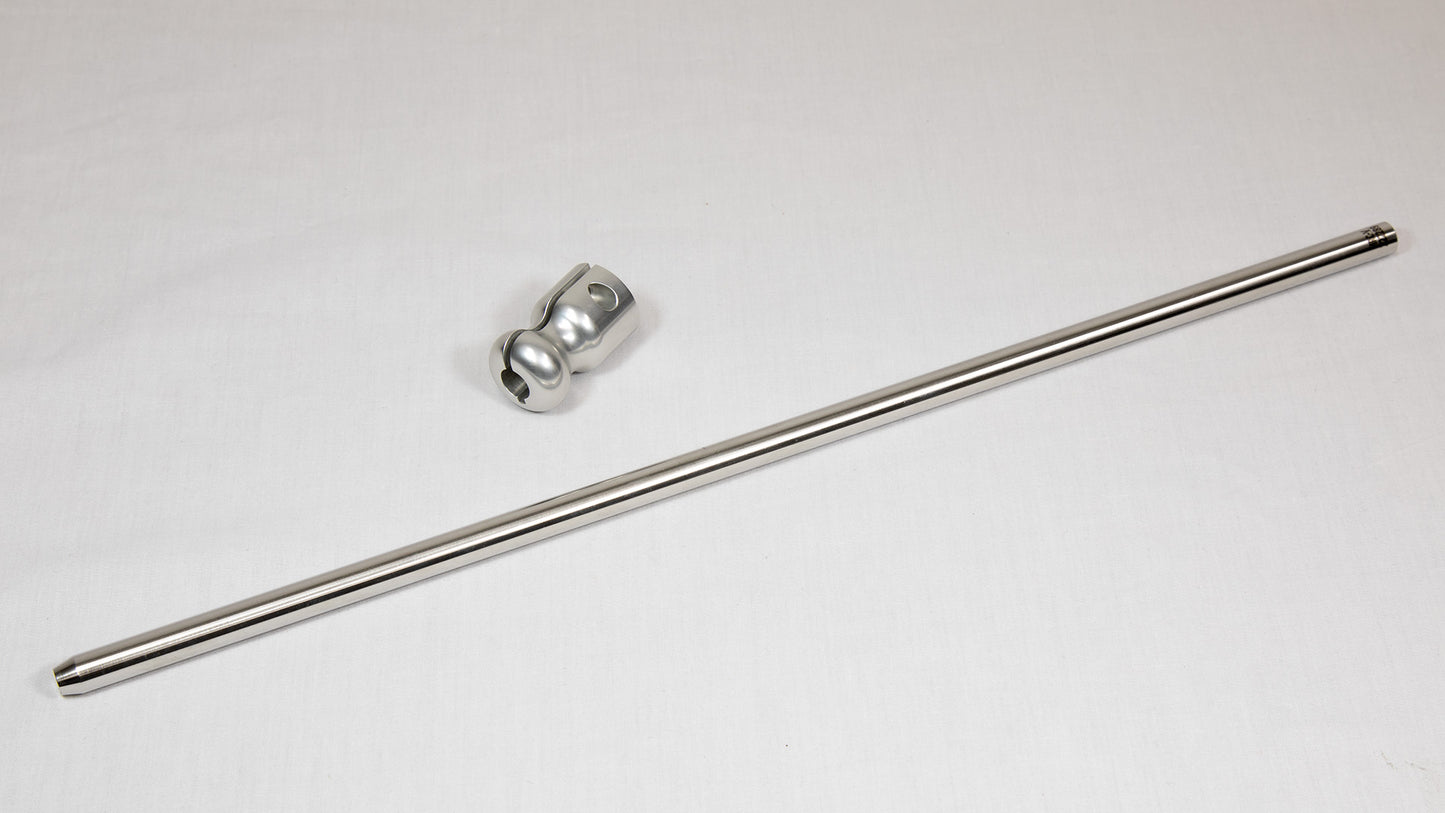 A stainless steel rod with a clamp resting on a white surface, showcasing its sleek design and functionality.