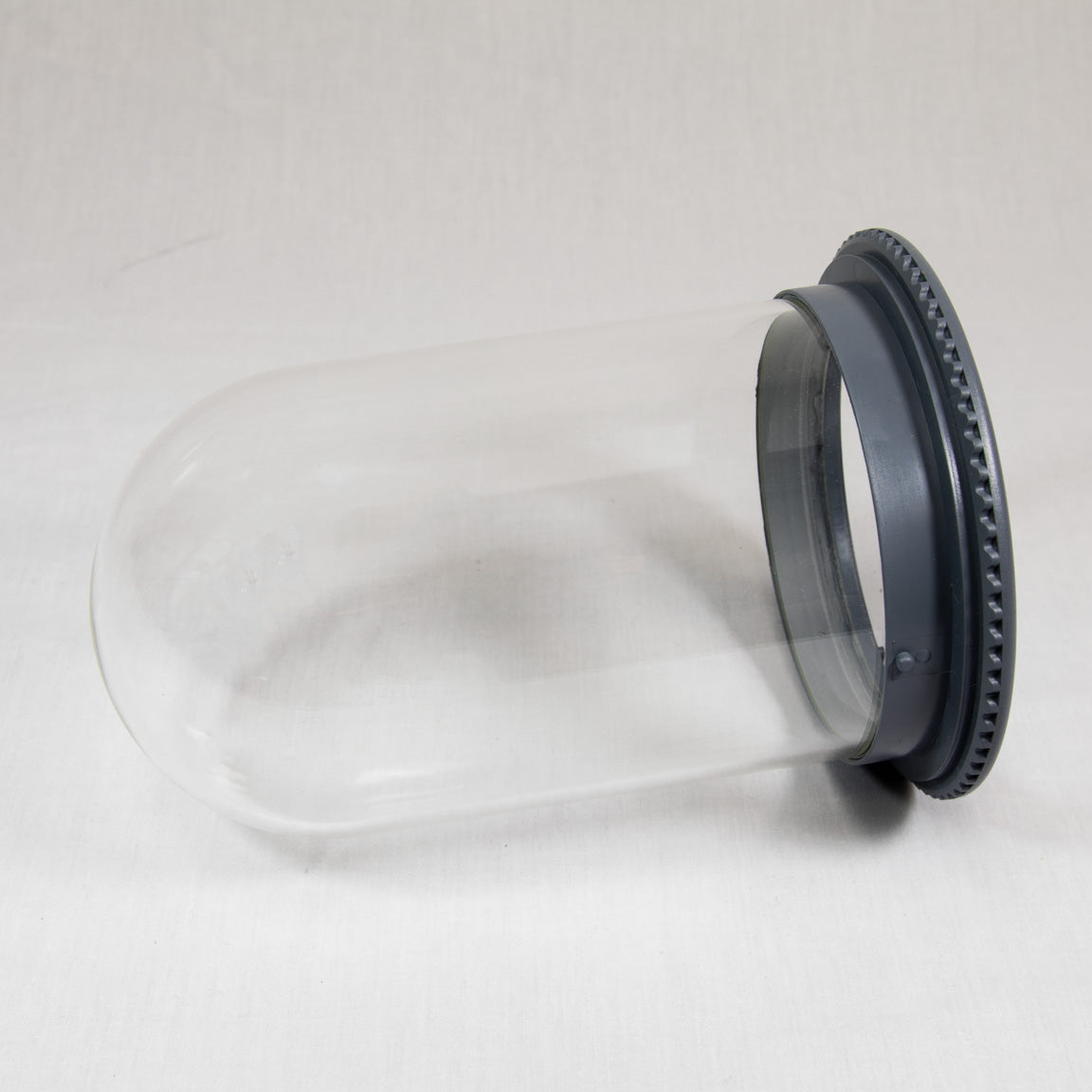 Clear plastic vessel with a black ring at the top, showcasing a simple and modern design.
