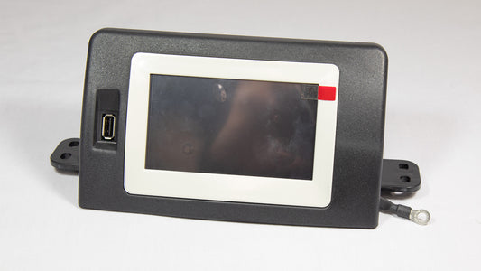 A compact monitor with a visible red button located on its surface.
