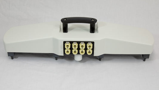 A white plastic device with eight colored ports connected to it, positioned on a neutral background.