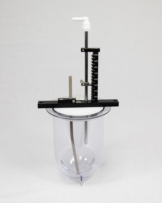 A glass jar on a metal stand, set against a plain white background, showcasing its transparent design and sleek structure.
