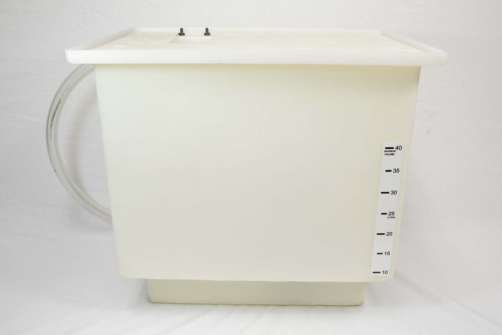 A white plastic container with a hose connected to it, likely used for storage or dispensing liquids.