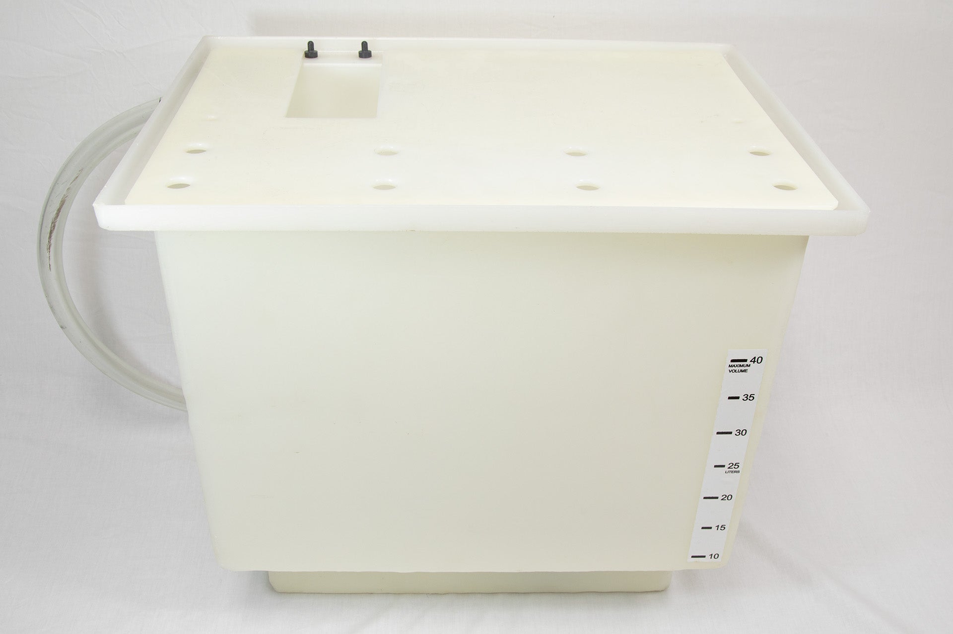 A white plastic container with a hose connected to it, likely used for storage or dispensing liquids.