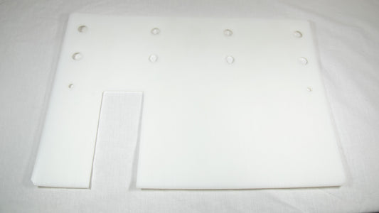 A white plastic plate featuring multiple holes evenly distributed across its surface.