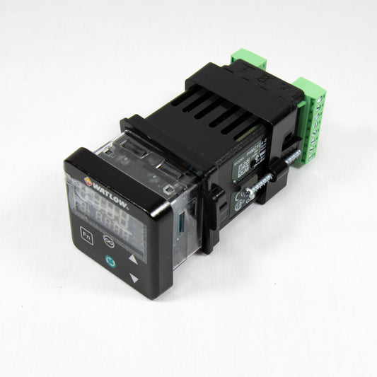 A small electronic device featuring a green and black cover, positioned on a neutral background.
