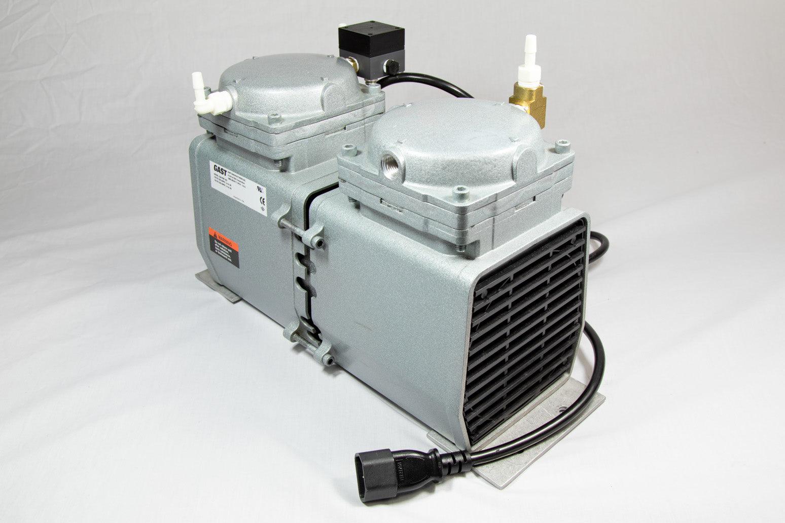 A small pump featuring two valves, designed for efficient control.