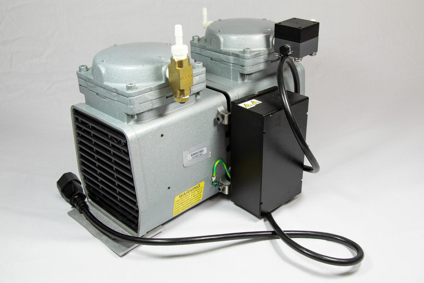 A small pump featuring two valves, designed for efficient control.