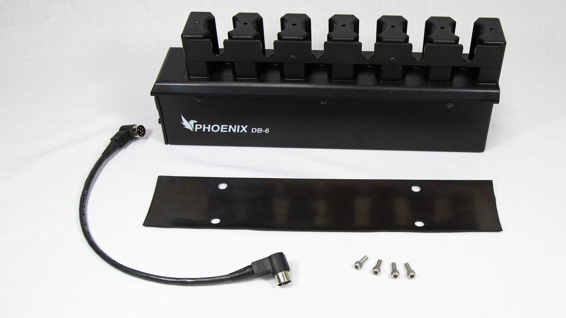 A black box with four wires extending from it, along with a power cord for connectivity.