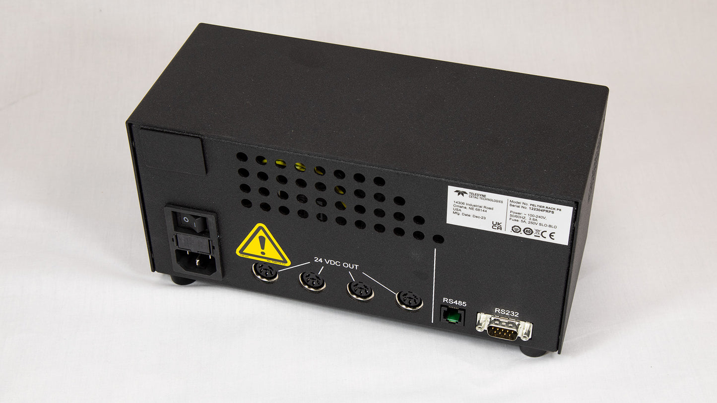 A black box featuring a prominent yellow warning label indicating potential hazards.