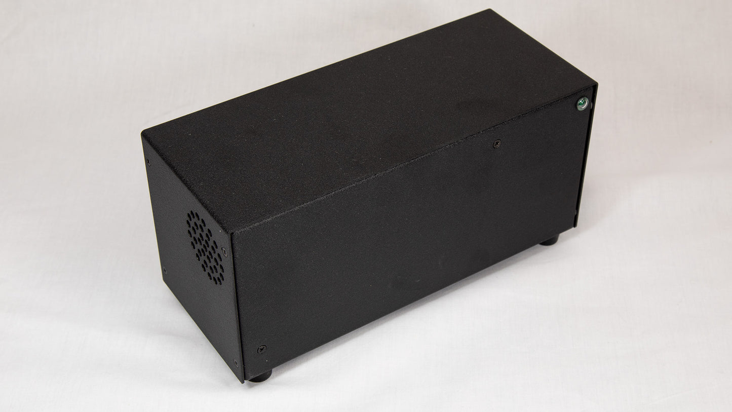 A black box featuring holes for dissipating heat.