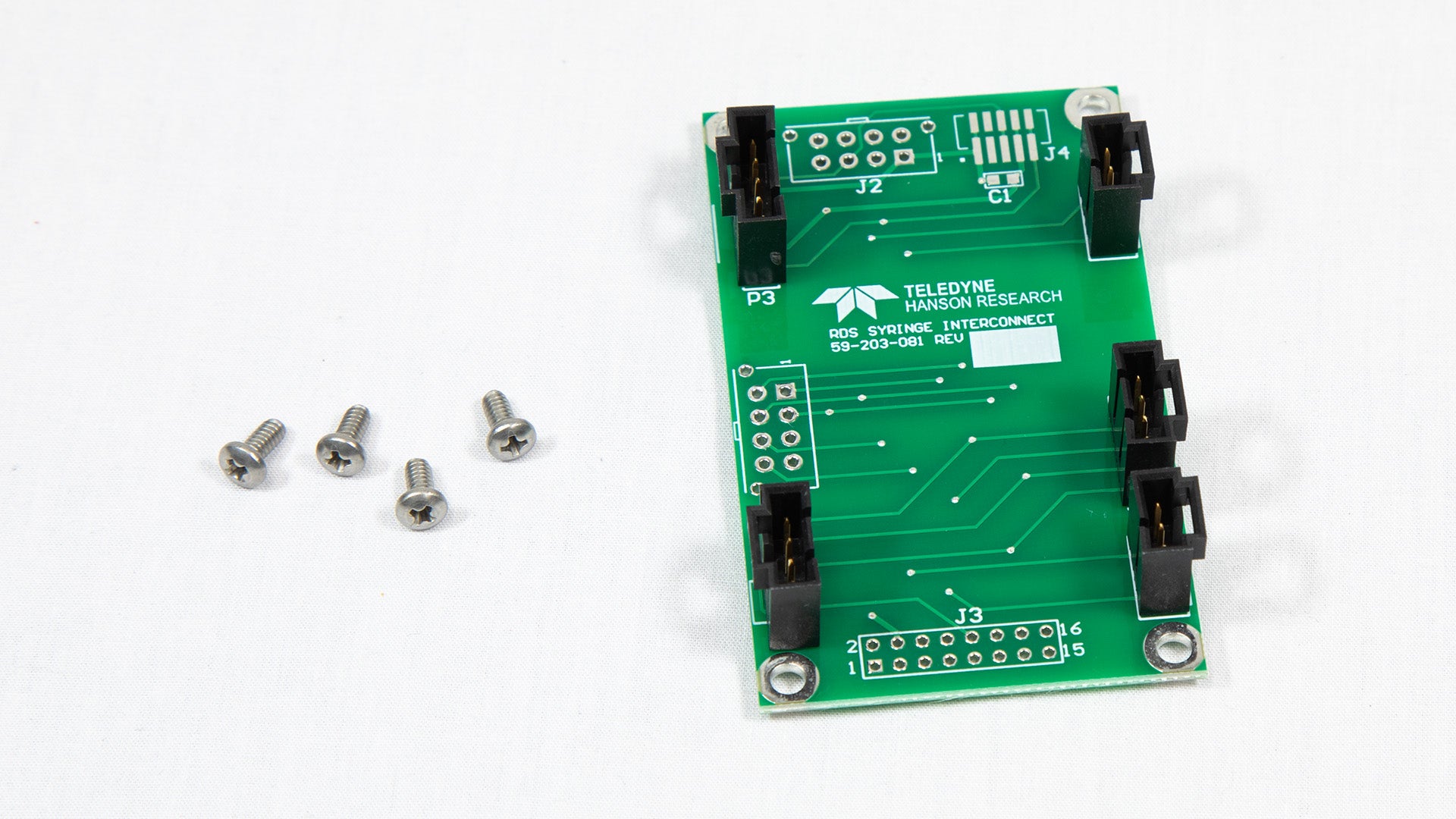A miniature electronic board equipped with screws, illustrating its structural elements and assembly details.