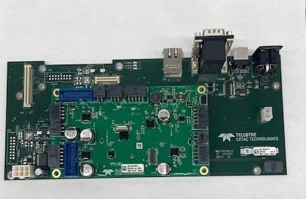 A close-up of a motherboard featuring a USB port and a power supply connection.