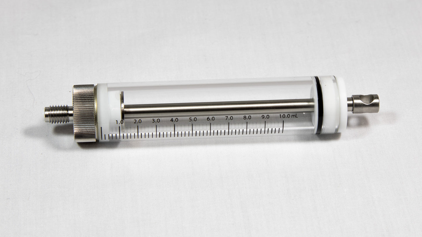 A transparent glass cylinder connected to a metal tube, representing a basic yet effective structural element.
