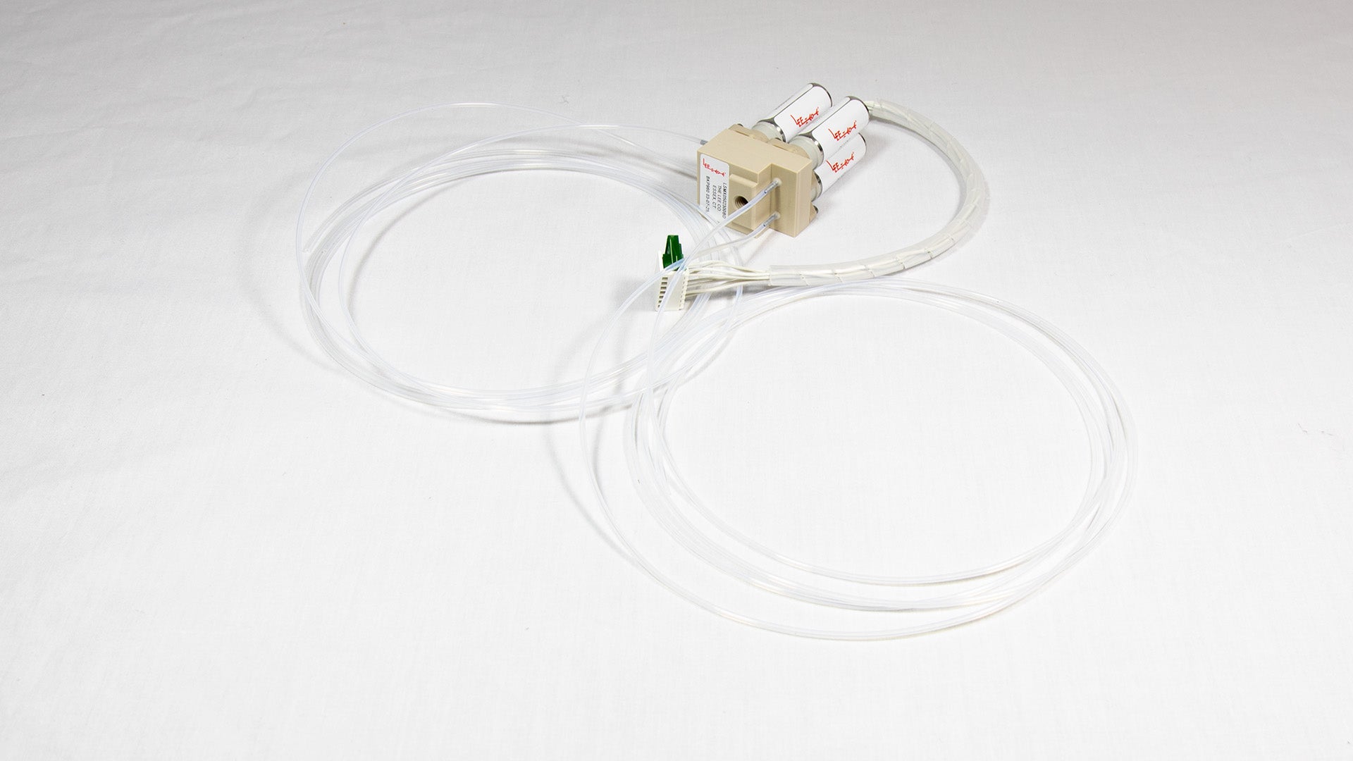 A valve with attached tubing, suggesting use in a laboratory or medical setting.