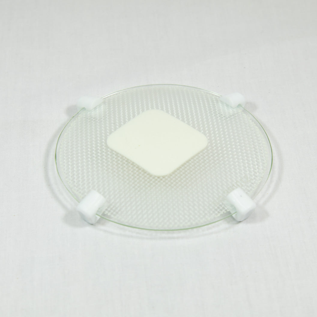 A transparent plate with a white patch, highlighting a neat and organized appearance.