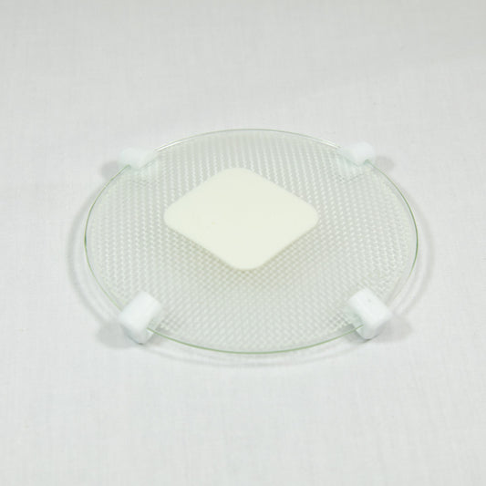 A transparent plate with a white patch, highlighting a neat and organized appearance.