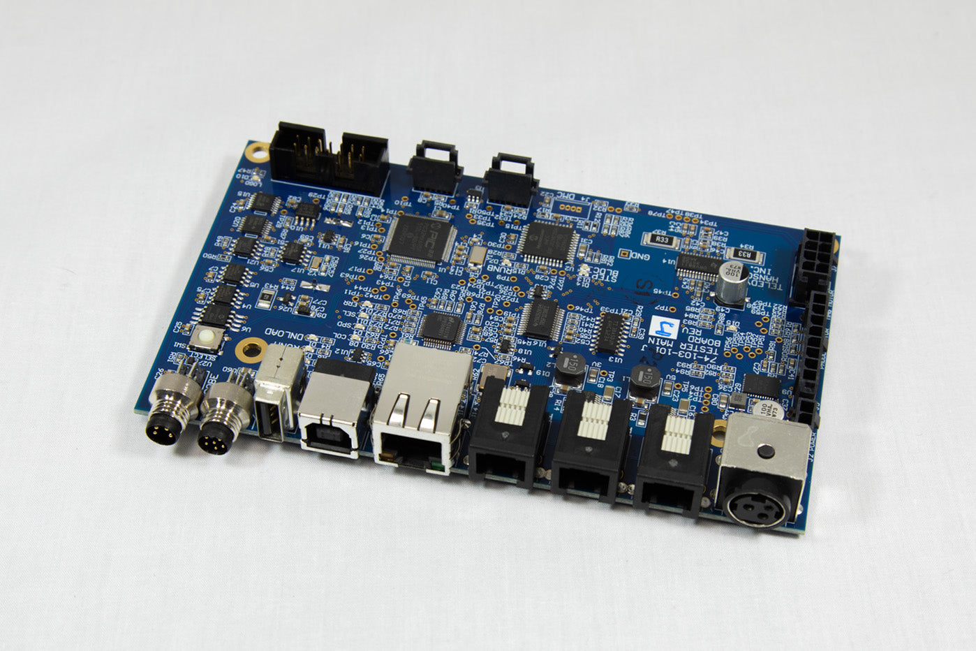 A small electronic circuit board featuring an number of components integrated into its design.
