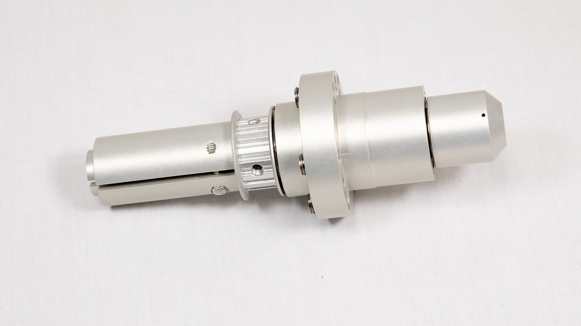 A shiny silver metal cylinder is centered on a white background, emphasizing its smooth texture and modern appearance.