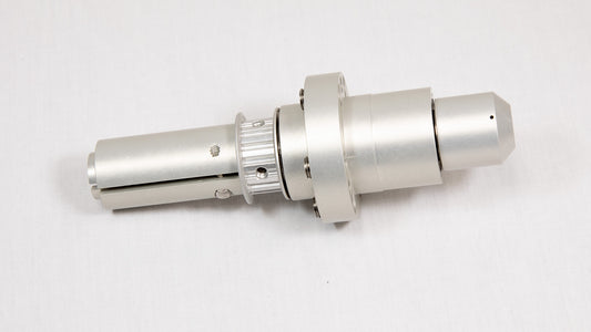 A shiny silver metal cylinder is centered on a white background, emphasizing its smooth texture and modern appearance.