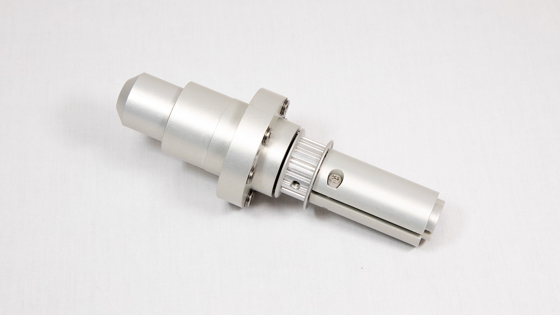 A shiny silver metal cylinder is centered on a white background, emphasizing its smooth texture and modern appearance.