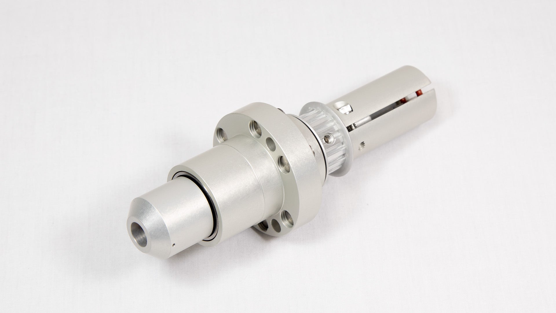 A shiny silver metal cylinder is centered on a white background, emphasizing its smooth texture and modern appearance.