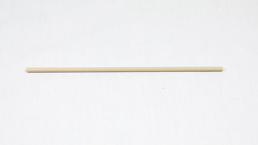 A long cylindrical shaped object pictured on a white background, creating a minimalist composition of everyday items.