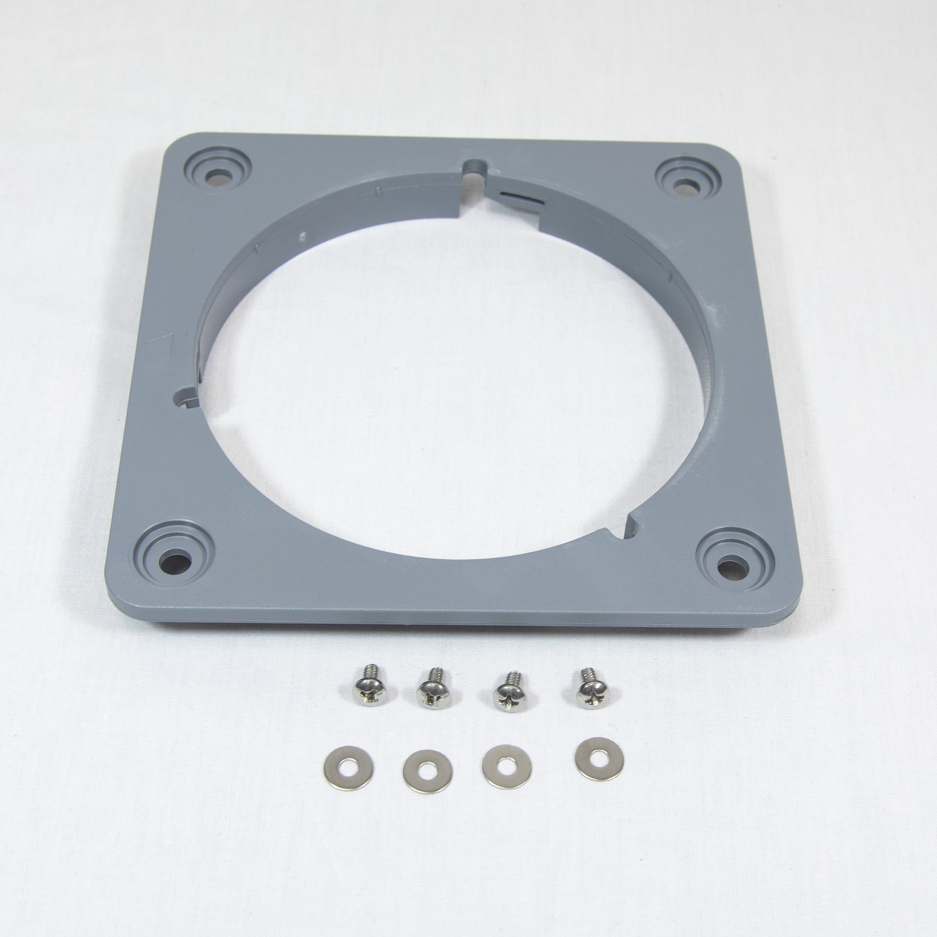 Gray plastic mounting plate accompanied by screws and nuts, arranged neatly for assembly or installation purposes.
